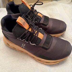 On Running Women’s Black and Orange Shoes